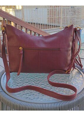 Margot S Crossbody Leather Bag Wine Adjustable Strap Gold Accents Tassel Detail